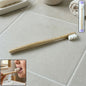 Wooden handle tooth cleaning brush