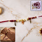 Ganesh Charm Rakhi with Feather Pendants
